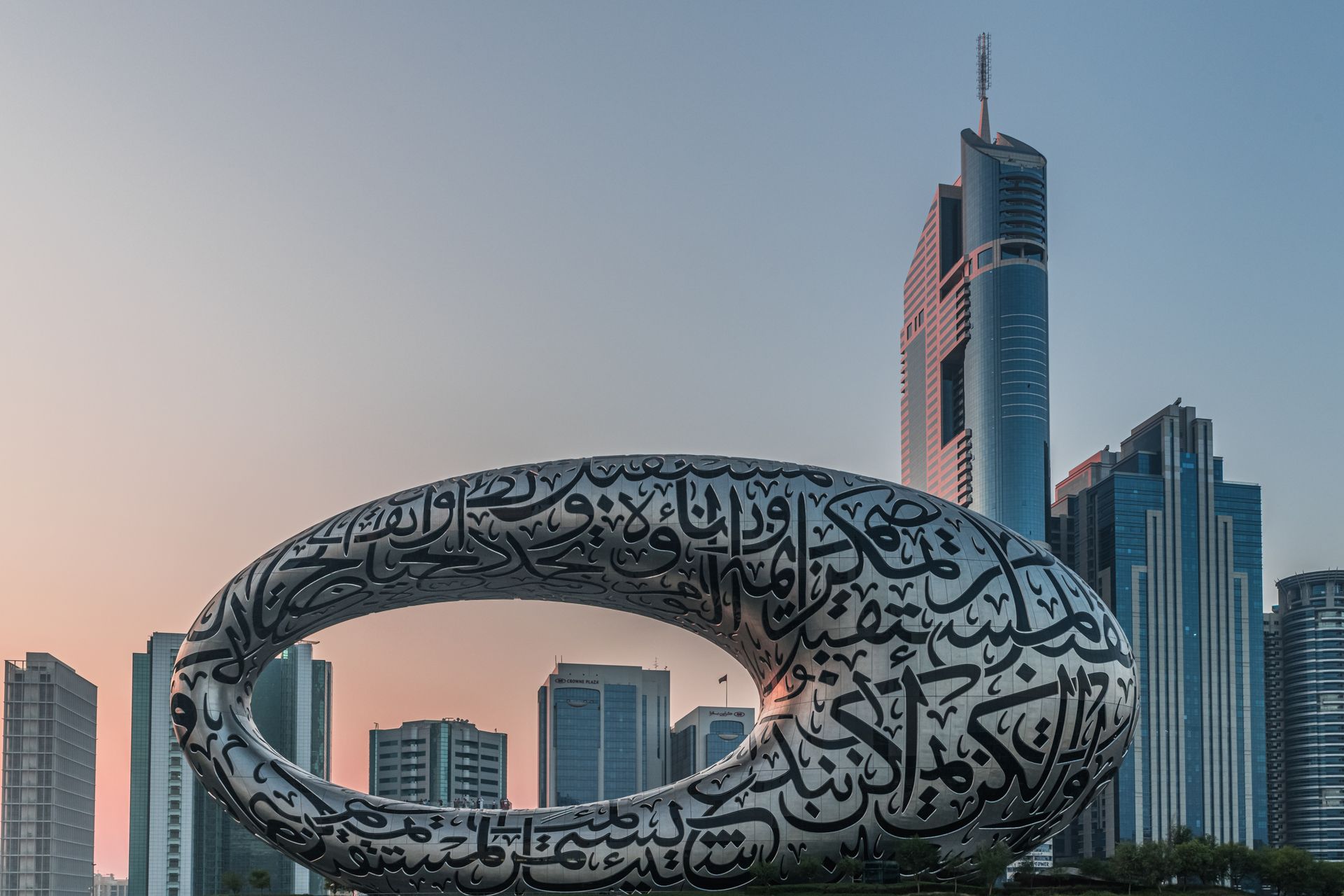 Dubai's skyline featuring Museum of the Future and modern skyscrapers at twilight.