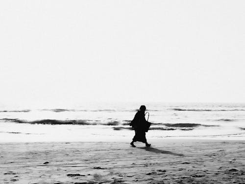 Woman Walking on a Beach