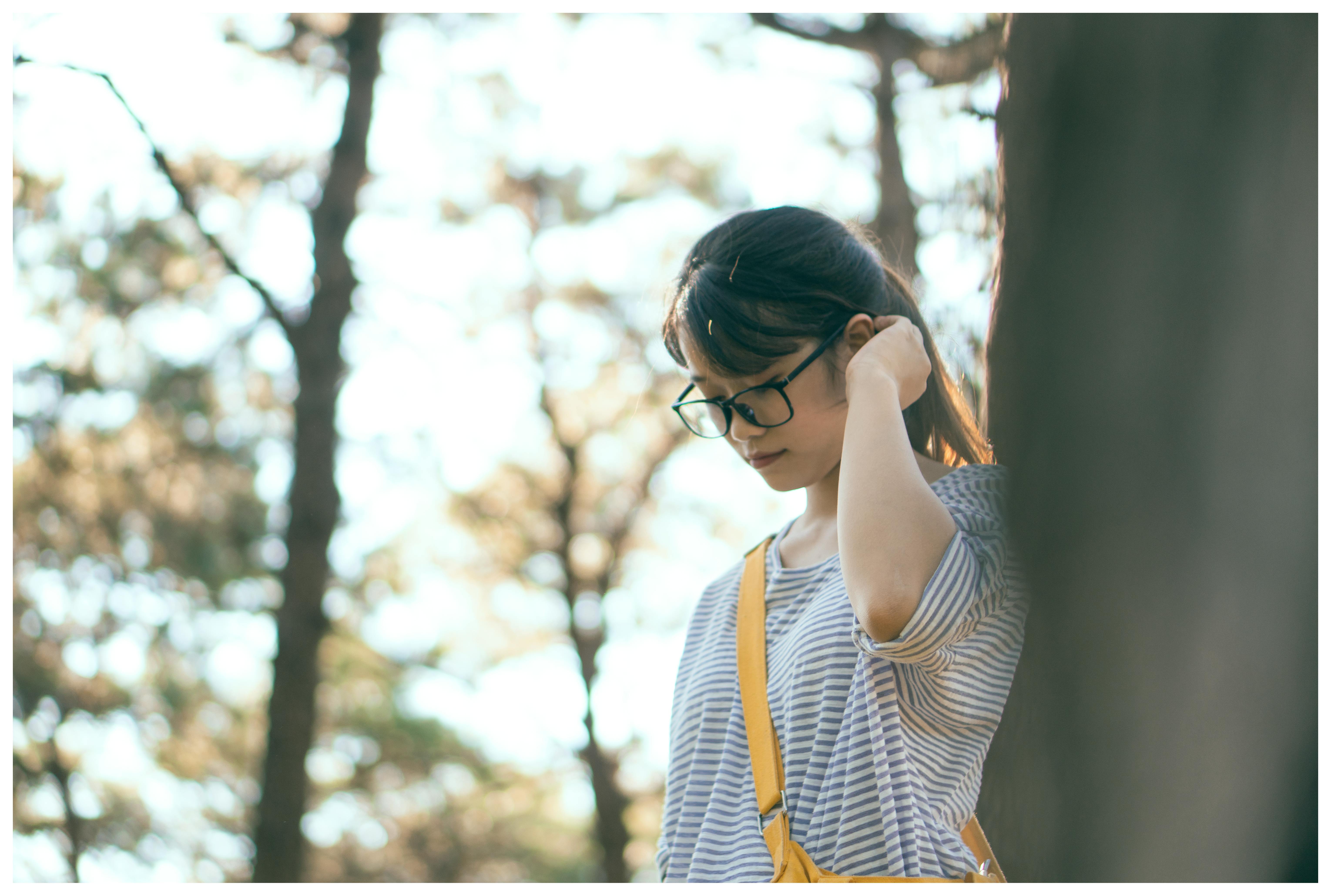 Woman Walking Under Trees · Free Stock Photo