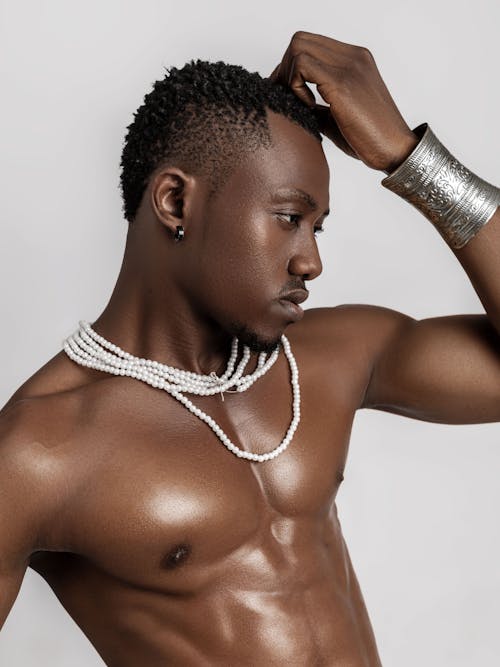 Shirtless Man Posing in Jewelry