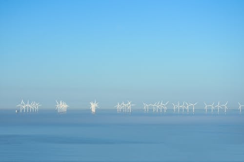 White Wind Turbines on the Ocean