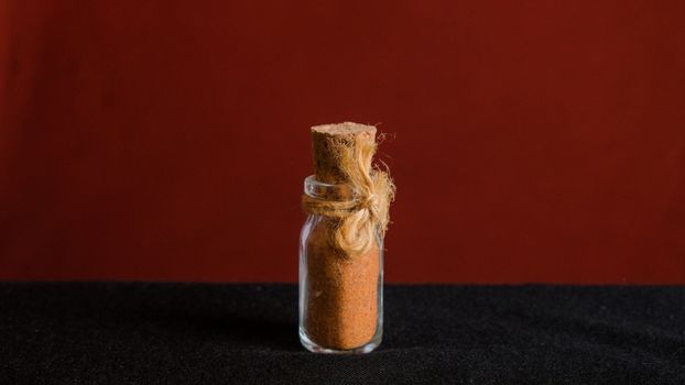 Clear Glass Condiment Shaker on Black Textile