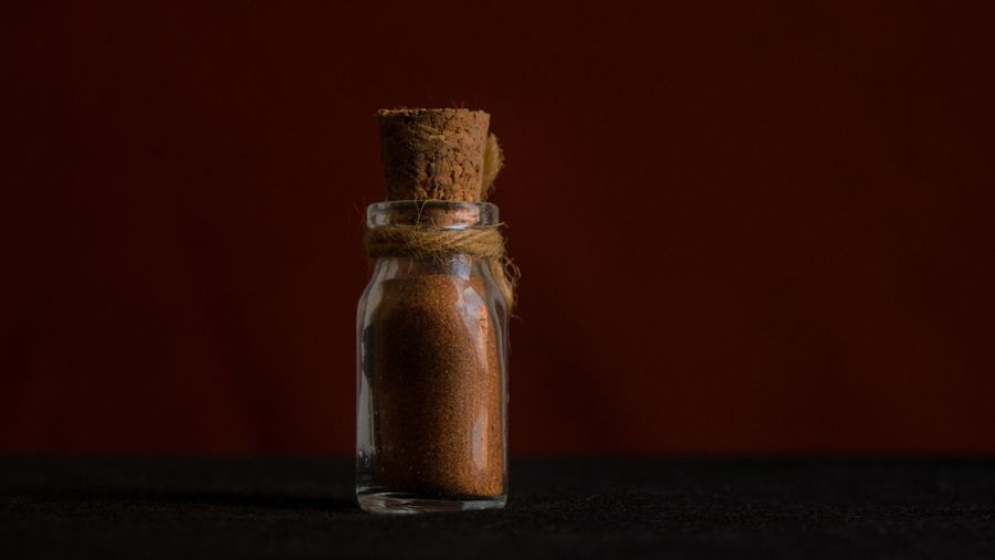 Glass bottle filled with brown sugar