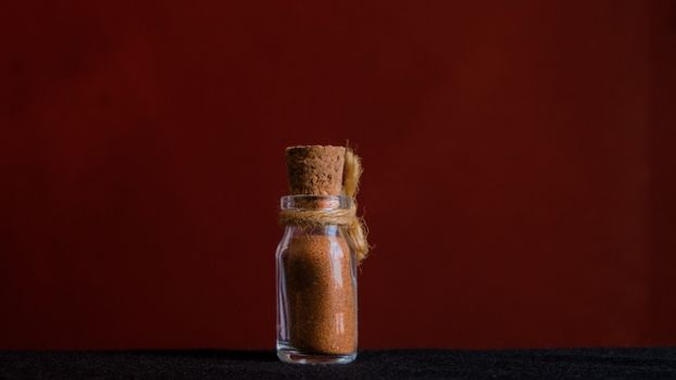 Clear Glass Condiment Shaker on Black Textile