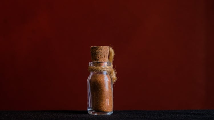 Sand In Tiny Glass Bottle