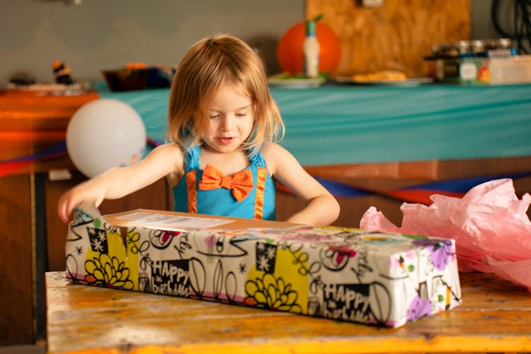 Girl Opening A Present