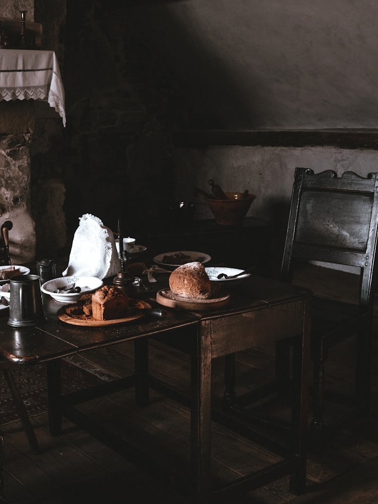 Bread And Plates On Table