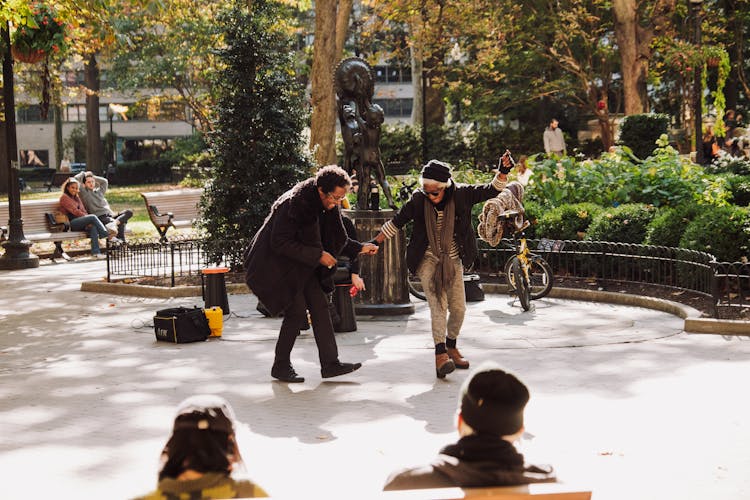 Couple Dancing In The Park 