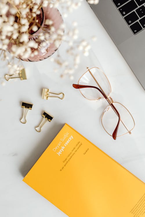 Book and Glasses on Office Table