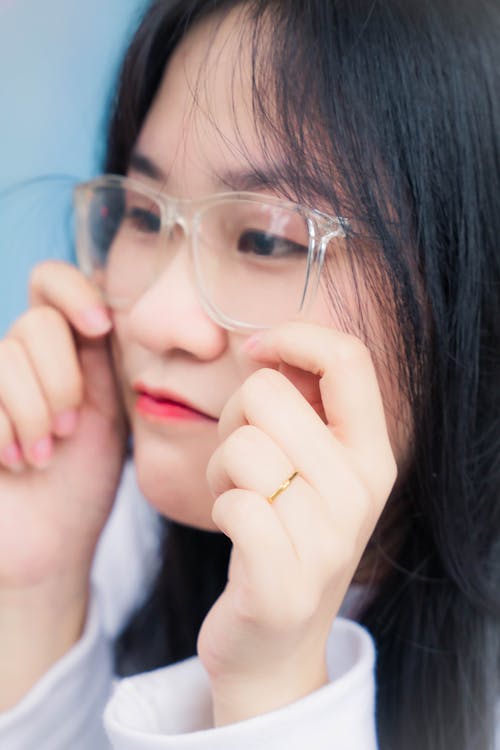 Portrait of Woman Wearing Transparent Rim Glasses