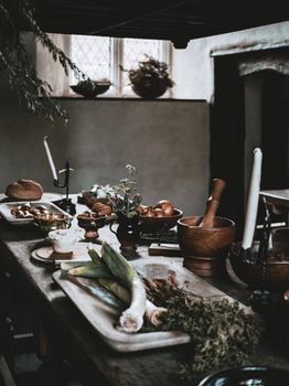 Charming rustic kitchen with fresh vegetables and kitchenware, evoking a cozy culinary atmosphere.