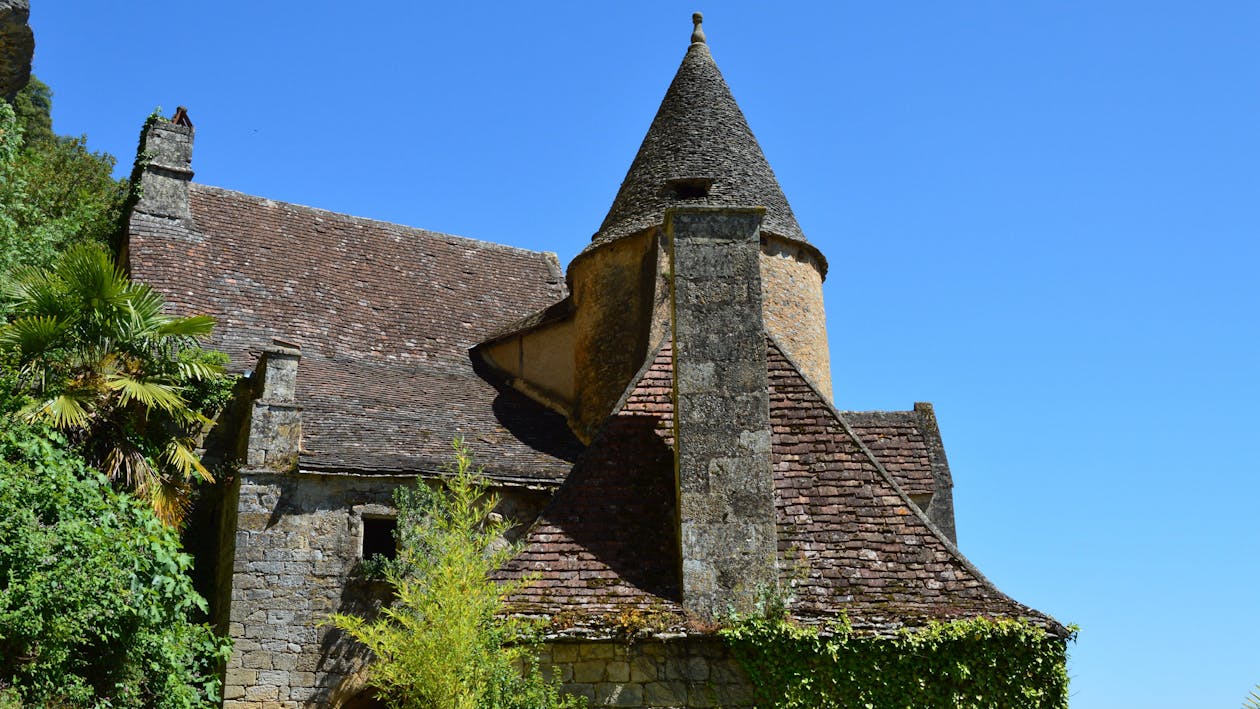 An image showing a chimney on an old stone house