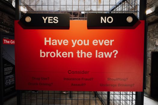 Board with a Text about Breaking the Law