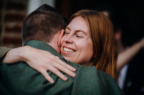 Smiling Woman Hugging a Man 