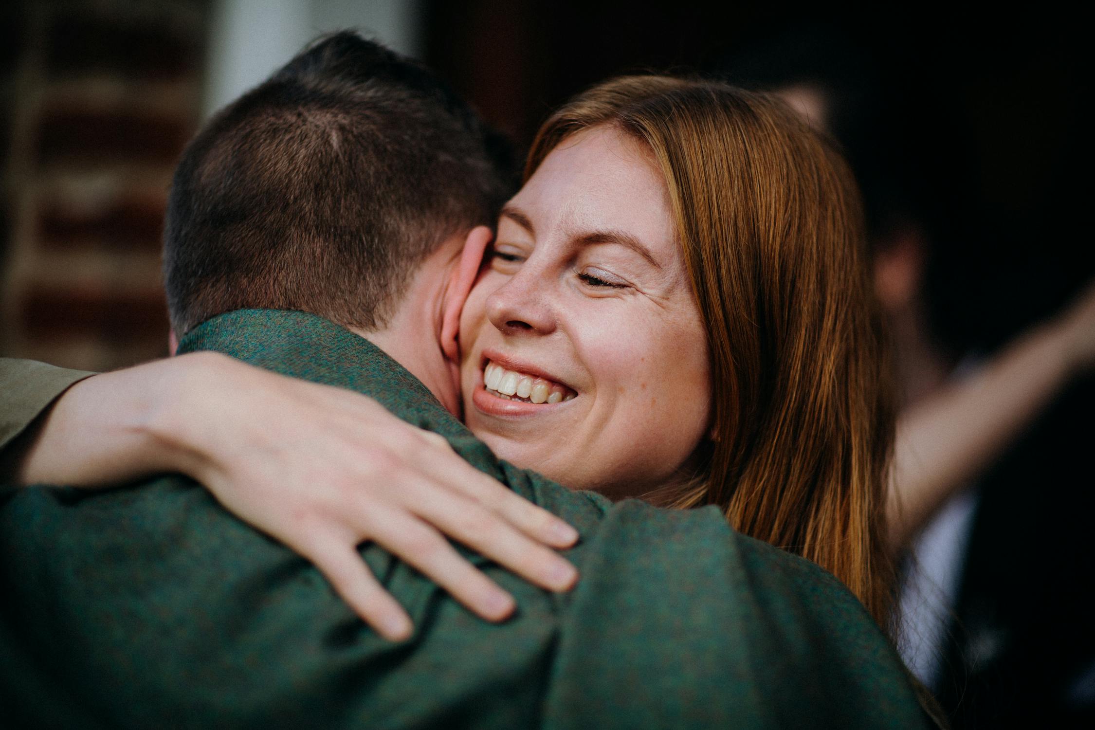 Smiling Woman Hugging a Man