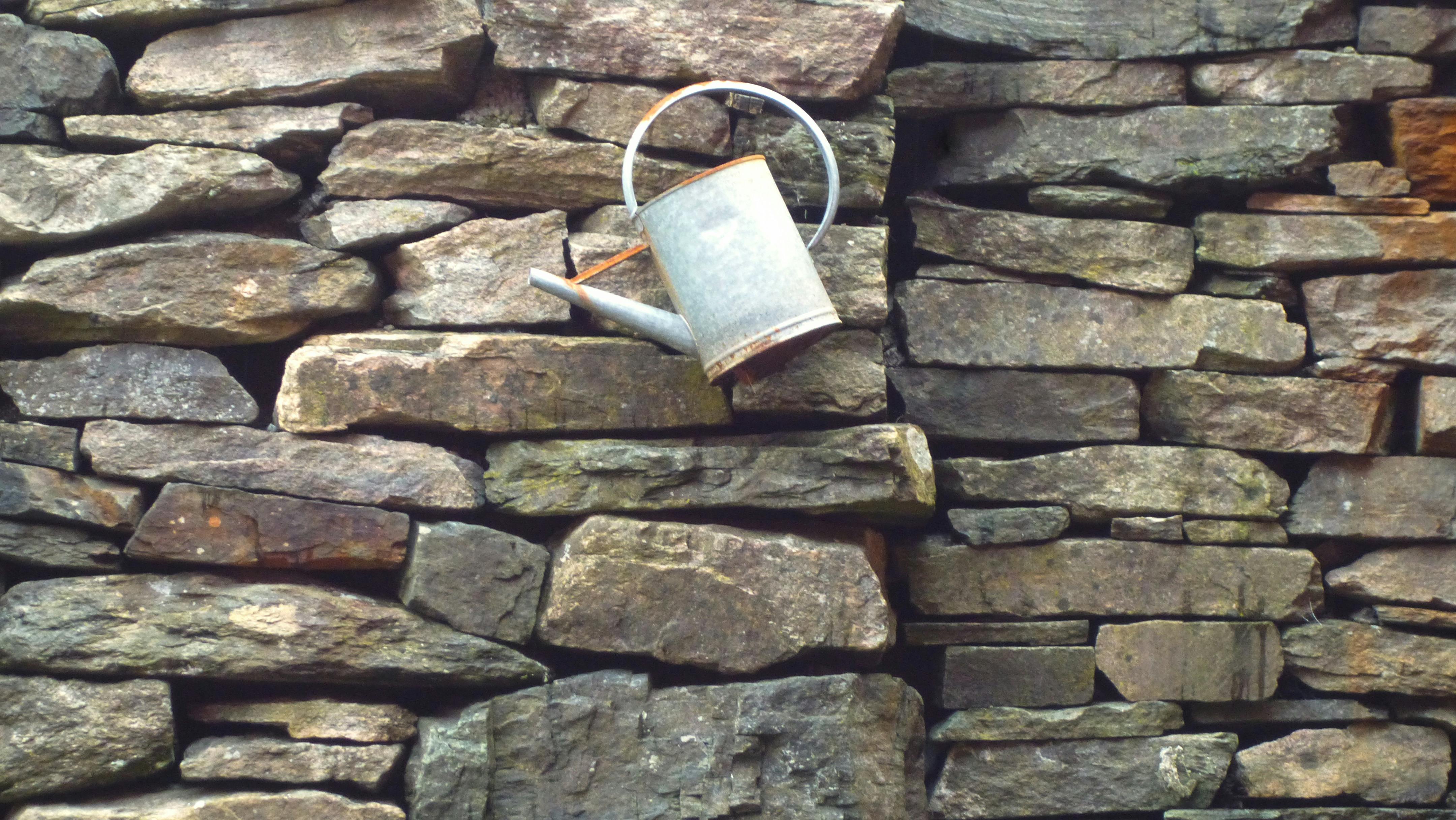 Free stock photo of stone wall, stones, watering can