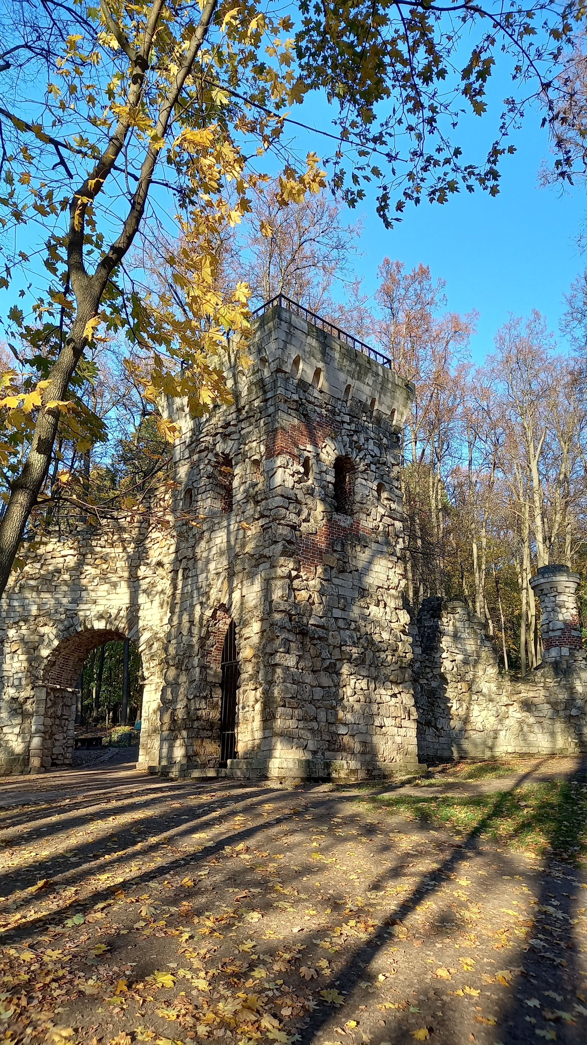 Sapiro Gate A Stone Gate Near Trees Under Blue Sky · Free Stock Photo