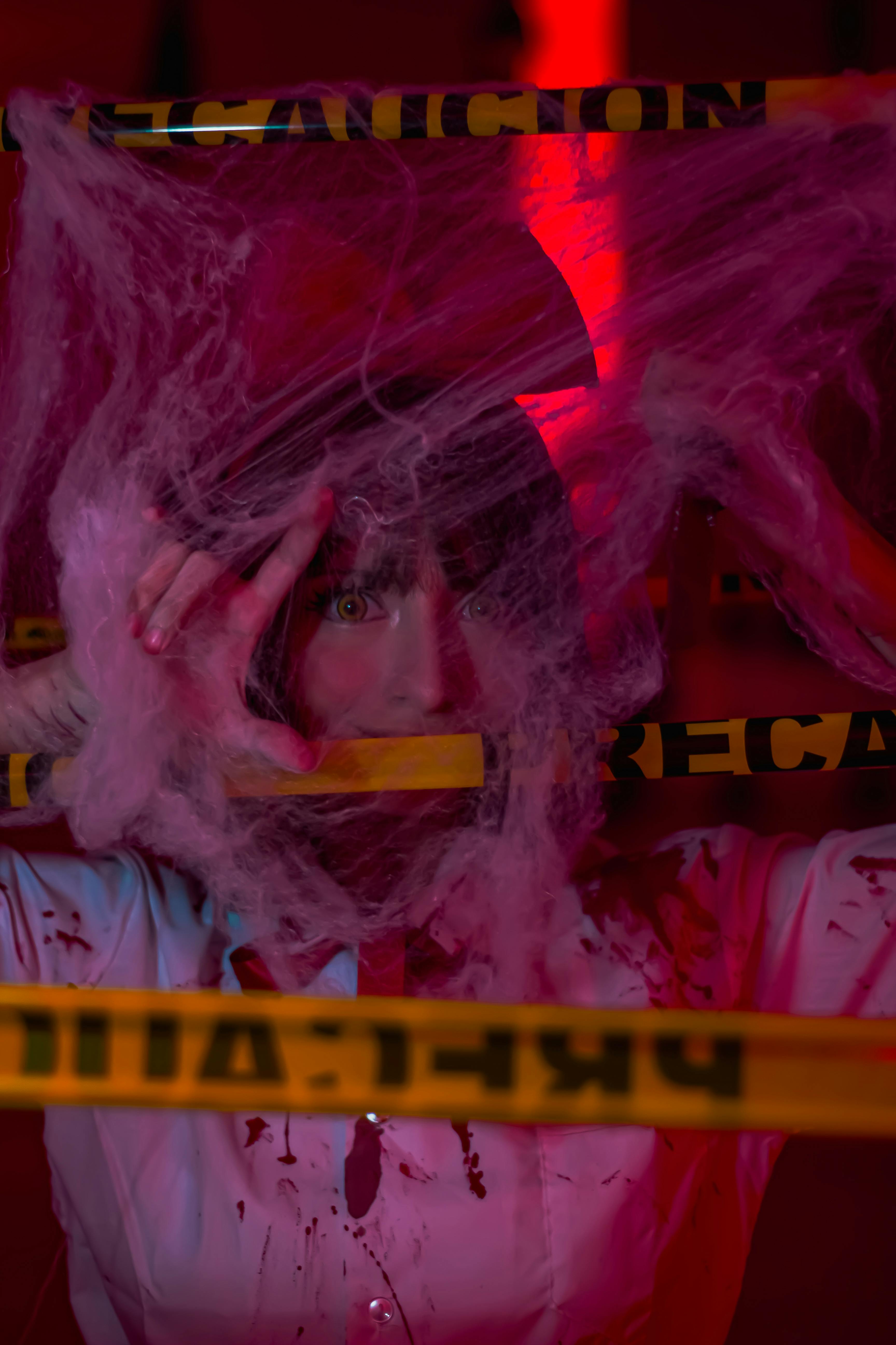 woman in a costume in a fake crime scene