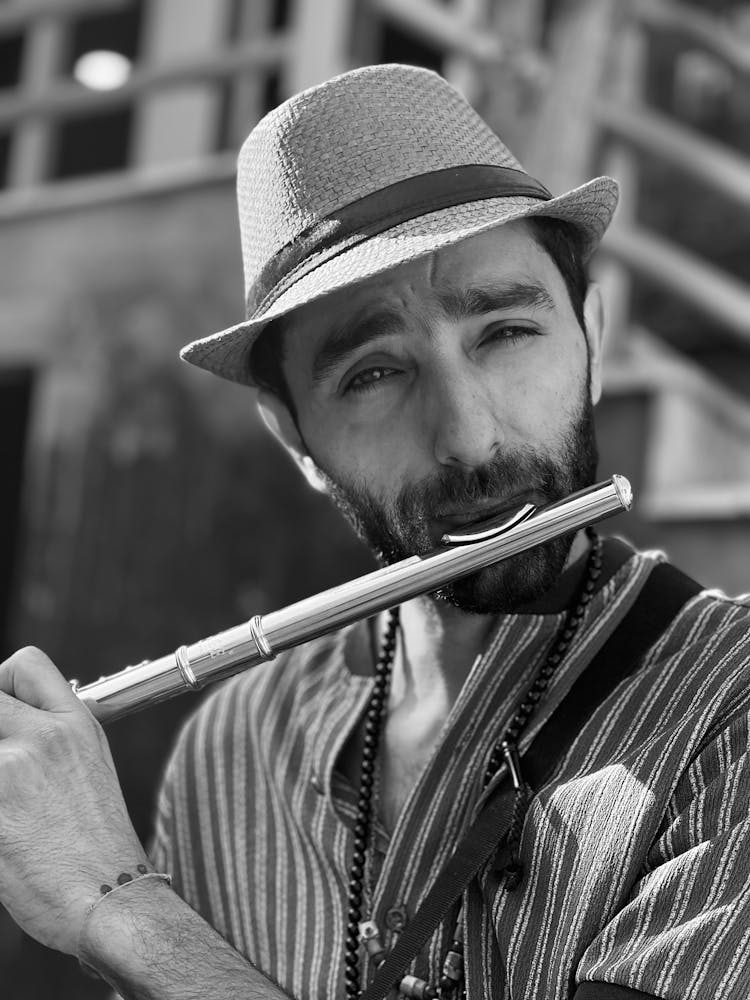 Man Playing On A Flute