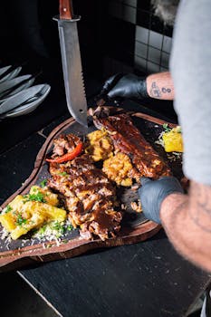 Tantalizing barbecue platter featuring a variety of grilled meats and sides on a wooden board.