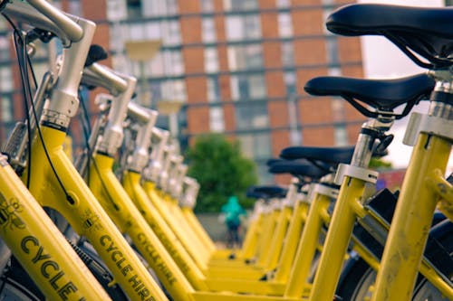 Depth of Field Photography of Yellow Bikes