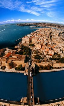 Stunning aerial view of Taranto in Puglia, Italy featuring historic architecture and coastal beauty.