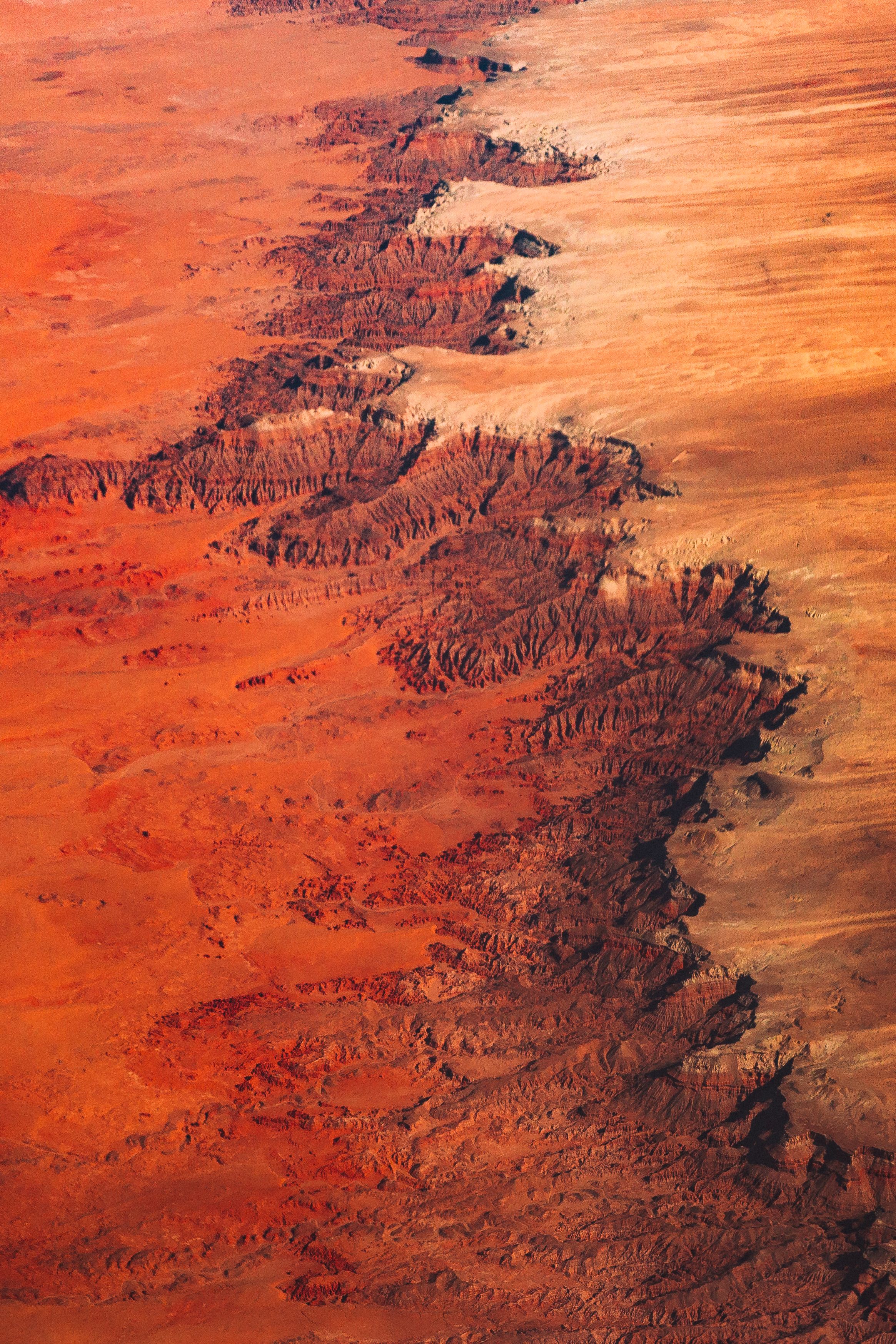 Stunning aerial perspective of the Grand Canyon's vibrant autumn landscape with erosion details.