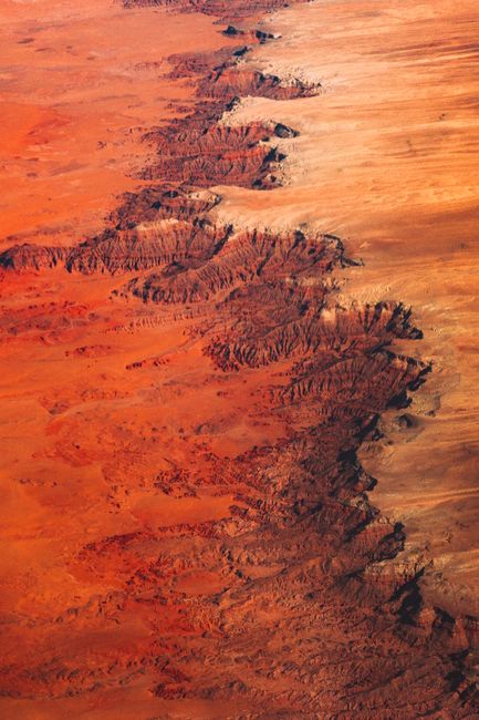 Stunning aerial perspective of the Grand Canyon's vibrant autumn landscape with erosion details.