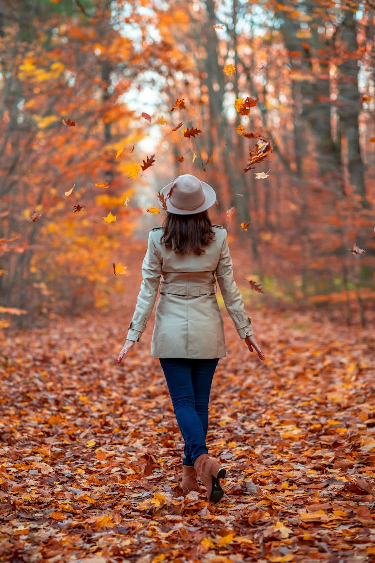 Woman In Hat Walking Autumn Park