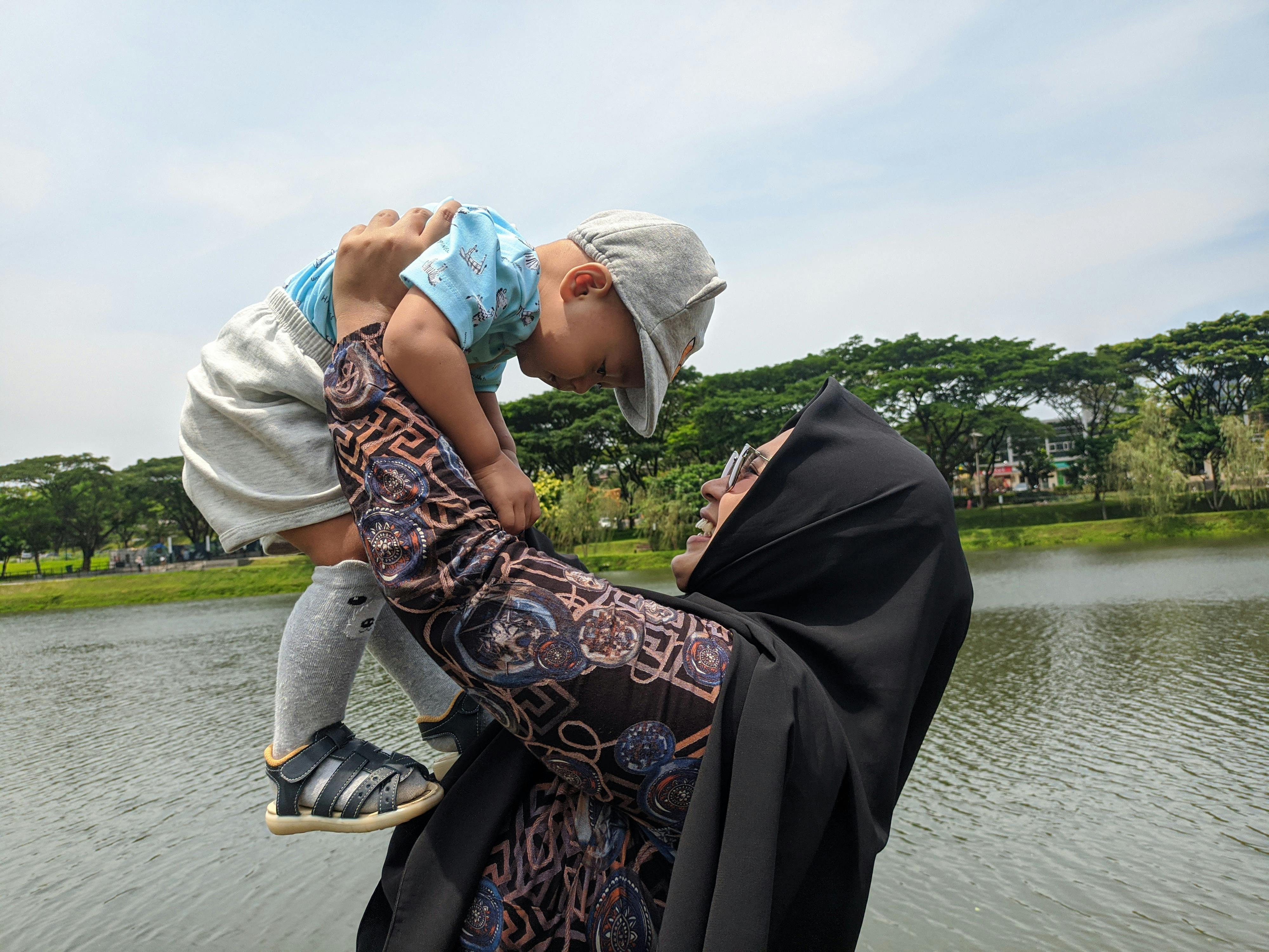 mother carrying a child