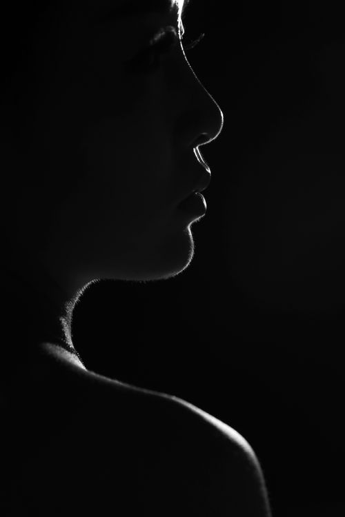 A black-and-white silhouette of a person in profile — photo by Song Wei on Pexels