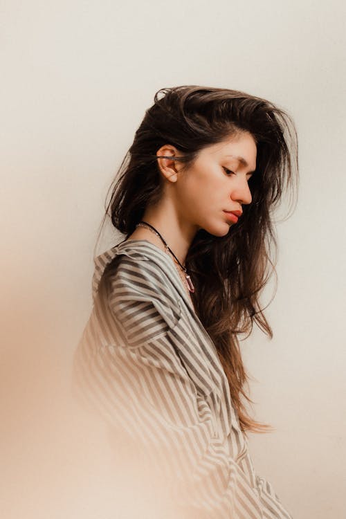 A Woman in a Striped Shirt