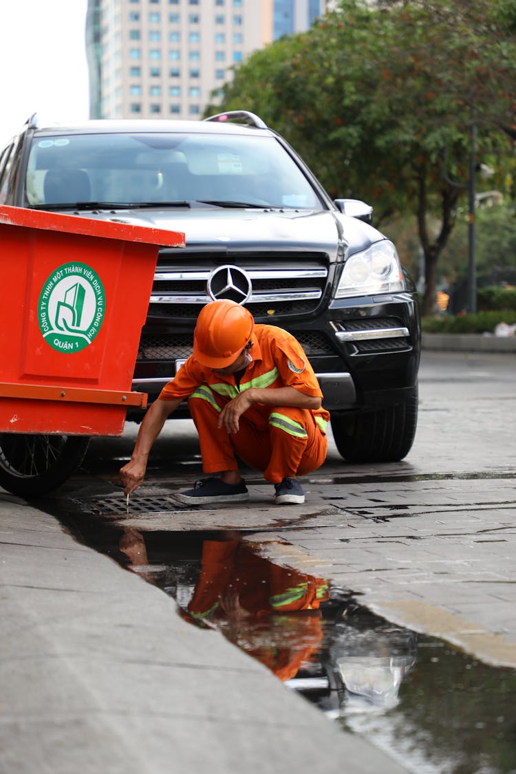 Plumber Working On Street