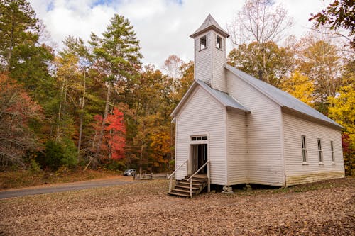 Wooden Church in a Forest in Fall 