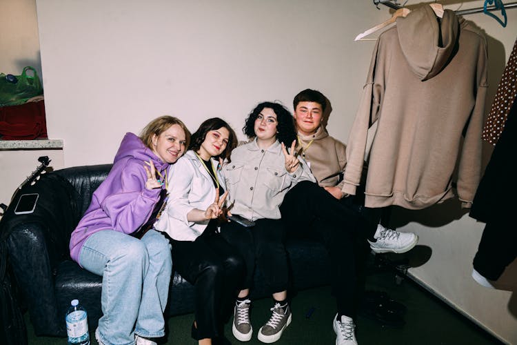 A Group Of Friends Sitting On The Couch