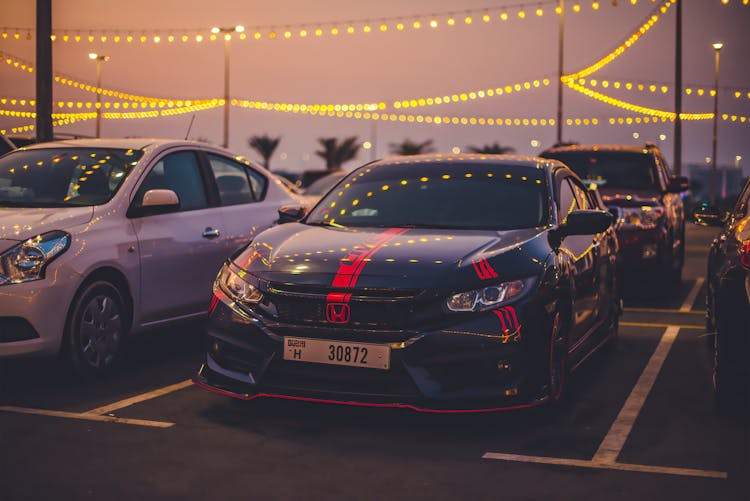 A Black Honda Car Parked On The Street