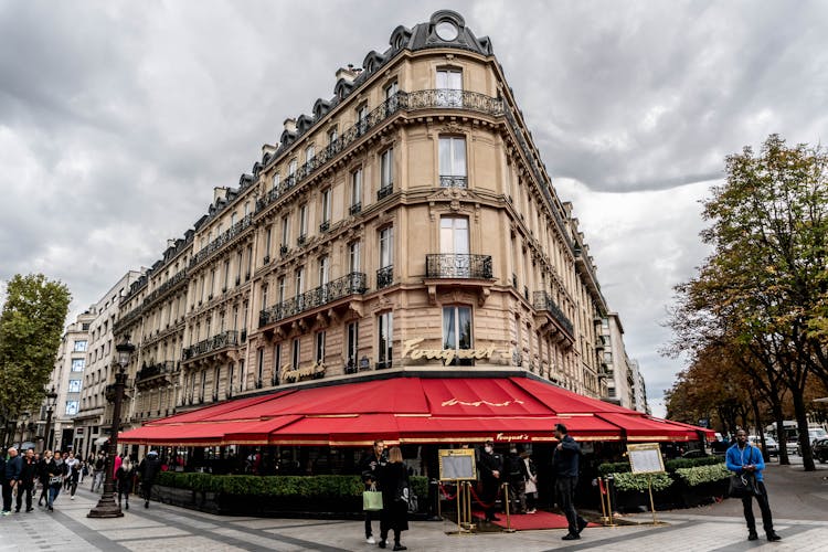 People Outside Fouquet's Restaurant In Paris, France