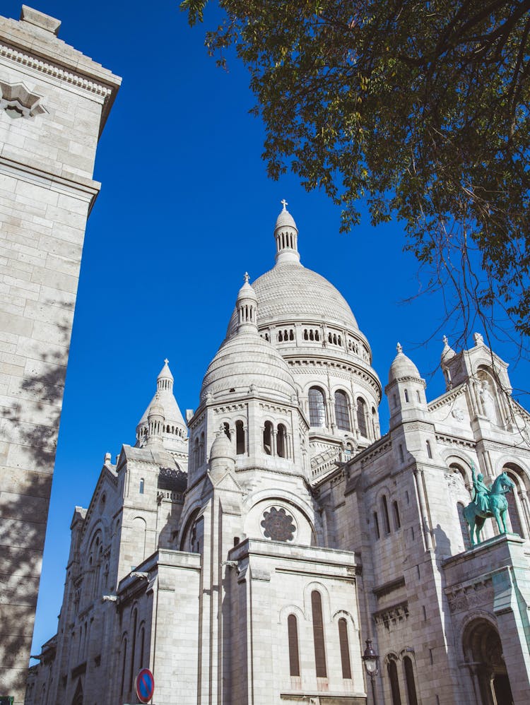 Basilica Of The Sacred Heart Of Montmartre In Paris Under Blue Sky