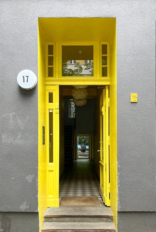 Yellow Door To A Hallway Free Stock Photo yellow-door-to-a-hallway-free-stock-photo