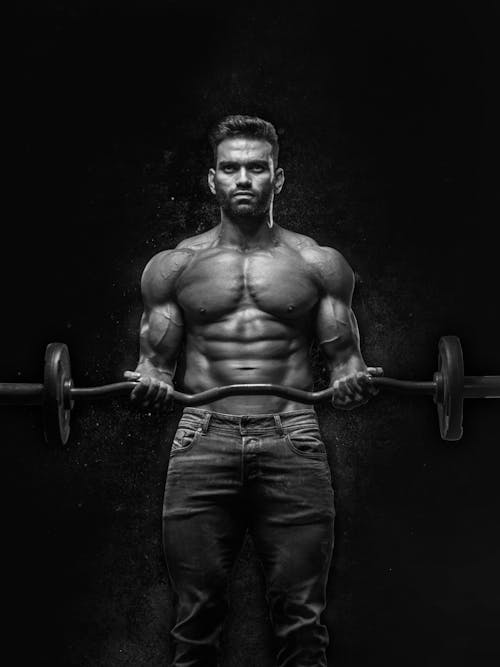 Free Man Holding Barbell Stock Photo