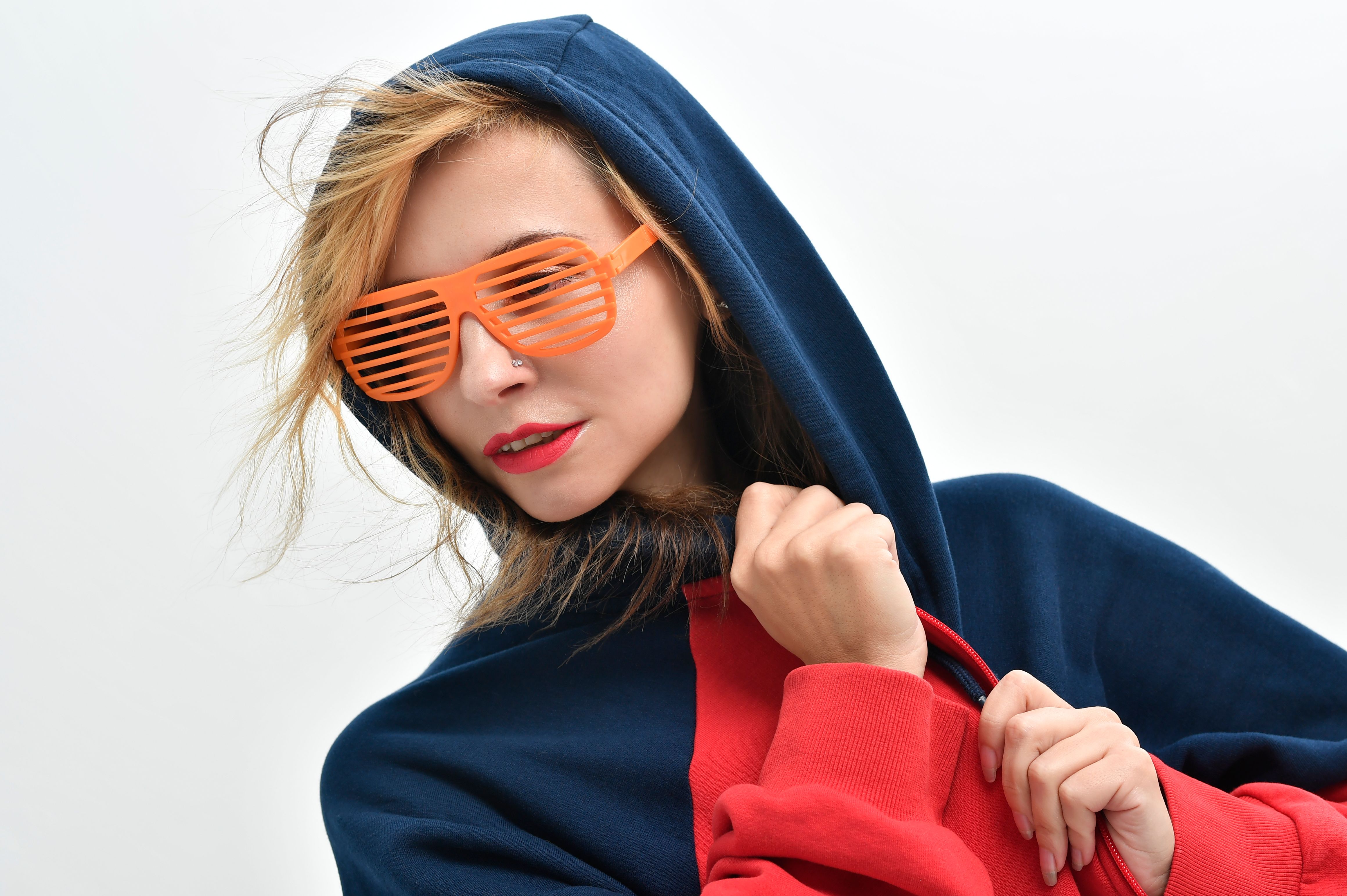 A Woman in Red and Blue Hoodie · Free Stock Photo