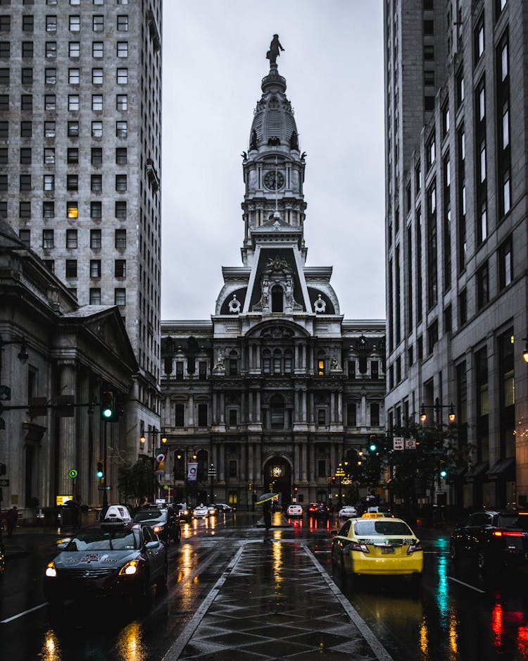 Philadelphia City Hall Towering Over Traffic On Street