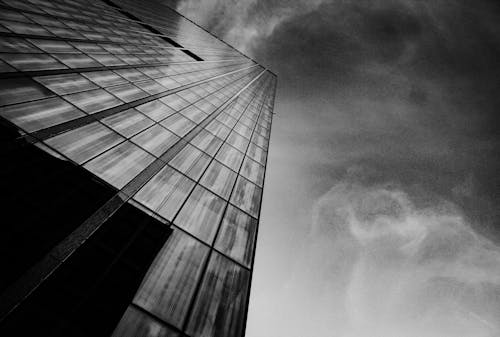 Grayscale Low Angle Photo Of High Rise Building 