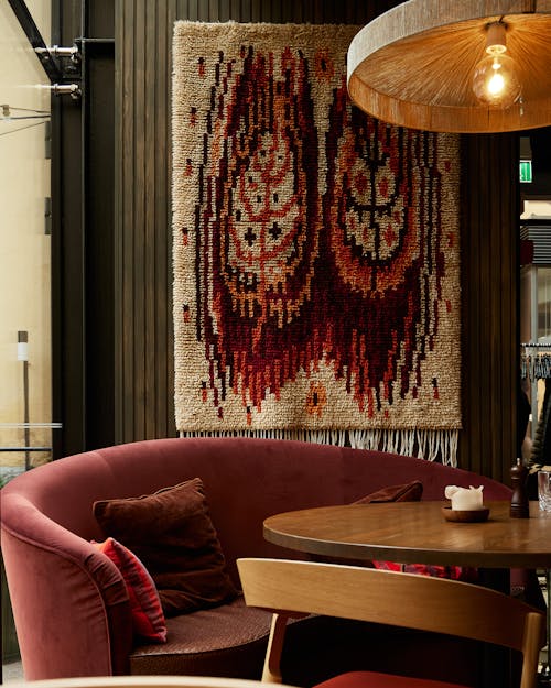 Red Couch Beside the Wooden Table