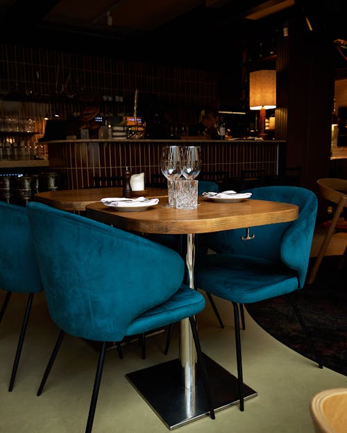 Wooden Table with Blue Chairs