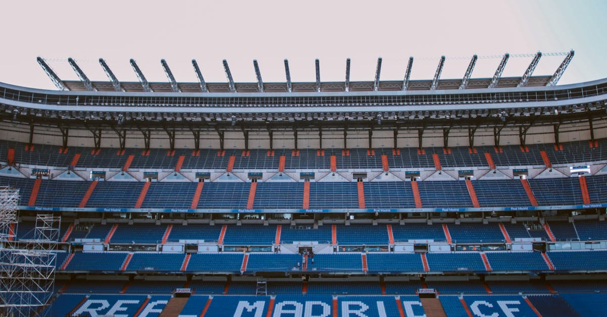 Empty stands of Santiago Bernabéu Stadium in Madrid, showcasing Real Madrid CF's seats.