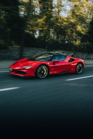 Red Ferrari on a highway