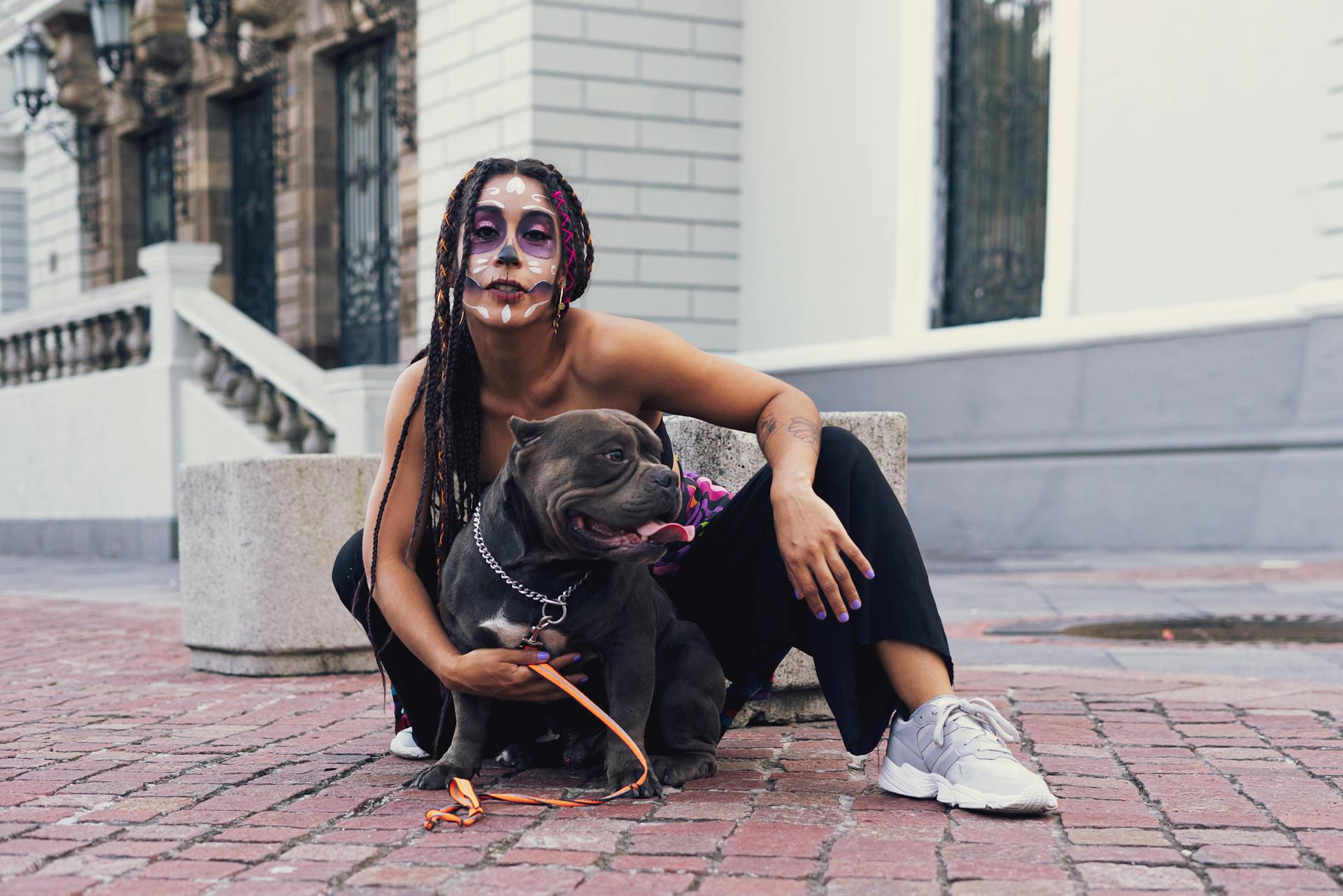 Woman Posing with Dog on Street