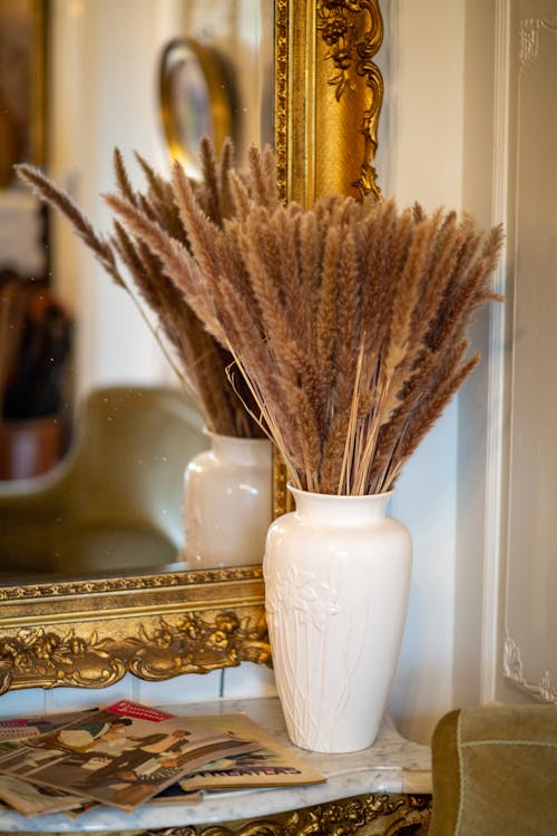 Brown Reeds in White Ceramic Vase