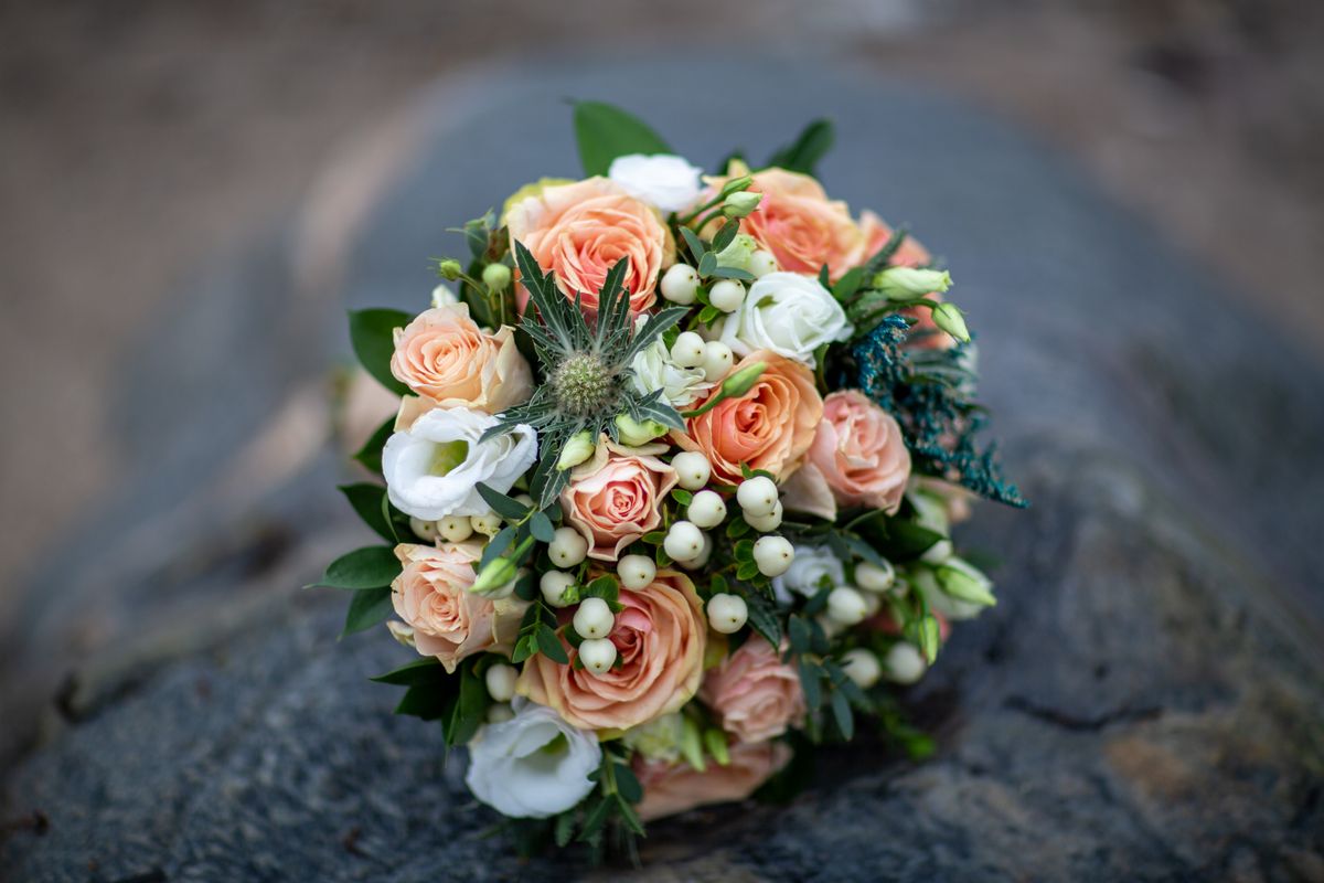 Bride holding handmade fuzzy wire flower bouquet